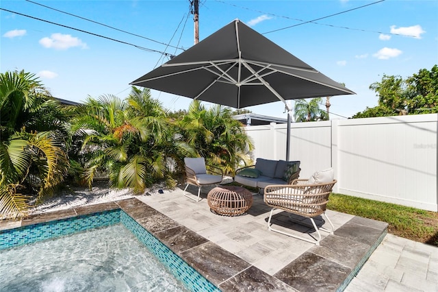 view of patio featuring an outdoor hangout area and a fenced in pool