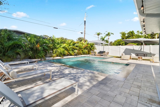 view of swimming pool with a patio area