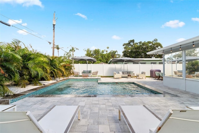 view of pool featuring a patio area and an outdoor living space