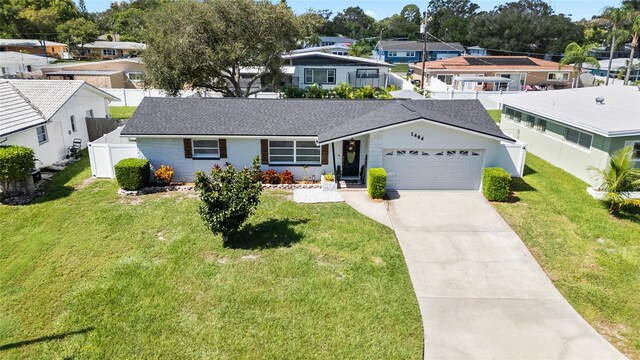 view of front facade with a front yard and a garage