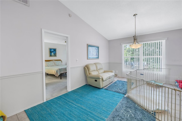 interior space featuring vaulted ceiling and ceiling fan