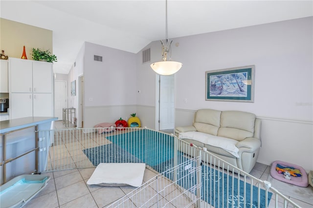 tiled living room with vaulted ceiling