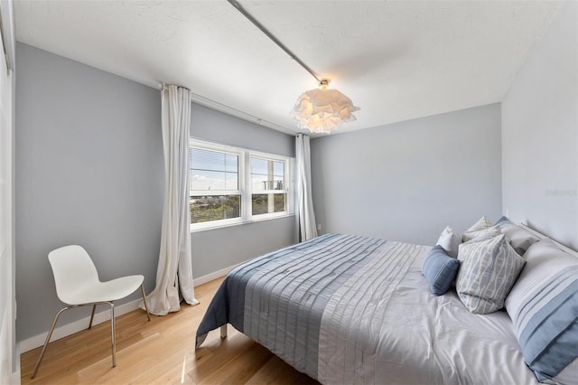 bedroom featuring hardwood / wood-style flooring