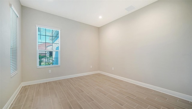 unfurnished room featuring light hardwood / wood-style flooring