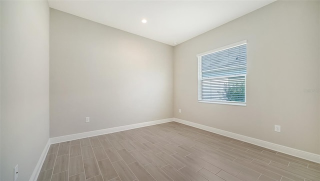 empty room with light hardwood / wood-style floors