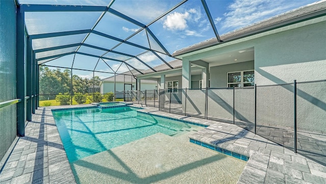 view of pool with a patio area and a lanai