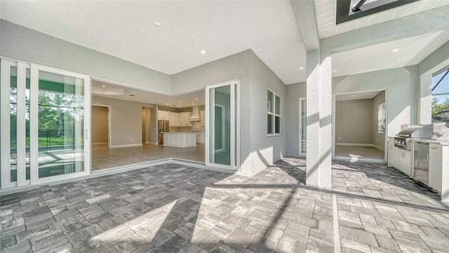 view of patio / terrace with a grill and an outdoor kitchen