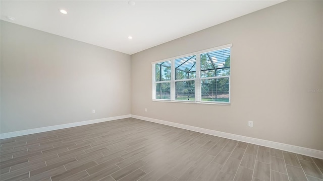 spare room featuring hardwood / wood-style floors