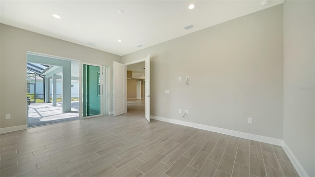 spare room with light wood-type flooring