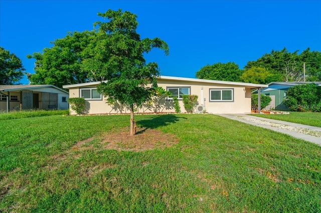 ranch-style home featuring a front yard