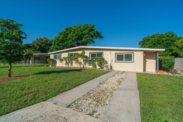 ranch-style home featuring a front yard