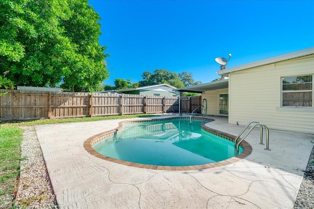 view of pool featuring a patio