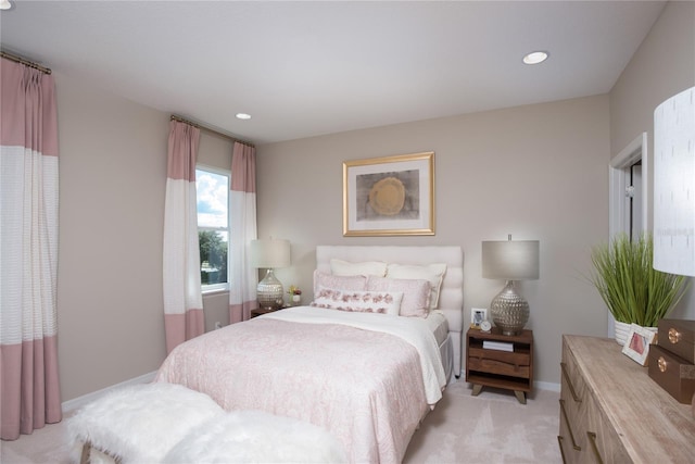 bedroom featuring light colored carpet