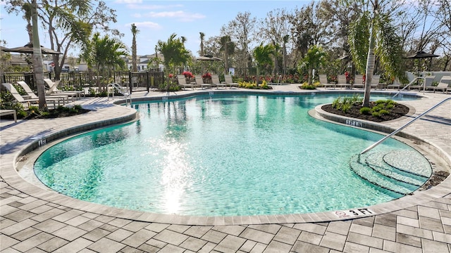 view of swimming pool featuring a patio area