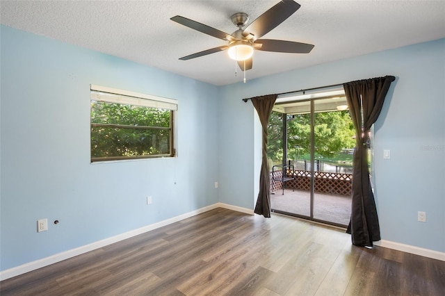 unfurnished room featuring a textured ceiling, ceiling fan, and hardwood / wood-style flooring