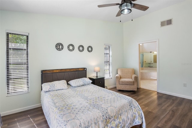 bedroom featuring ceiling fan, ensuite bathroom, and dark wood-type flooring