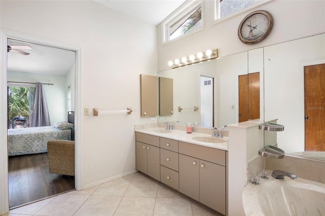 bathroom with ceiling fan, hardwood / wood-style flooring, plenty of natural light, and vanity