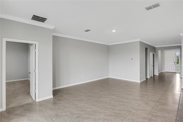 unfurnished room featuring crown molding and light tile patterned floors