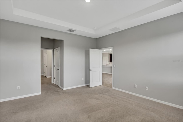 unfurnished bedroom with light colored carpet