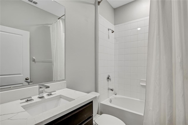 full bathroom with shower / tub combo with curtain, vanity, and toilet