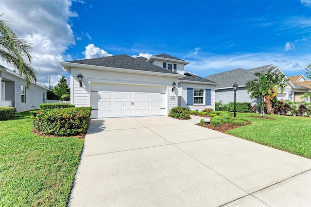 view of front of home featuring a garage and a front yard