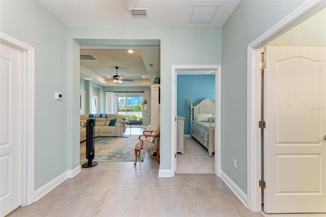 corridor with a textured ceiling