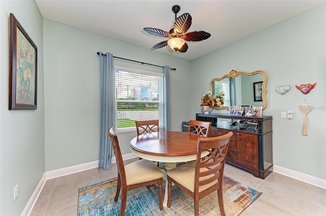 dining space featuring light tile patterned floors and ceiling fan