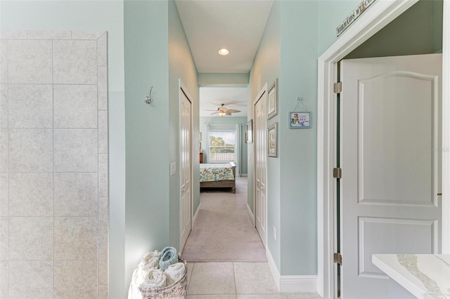 hallway with light colored carpet