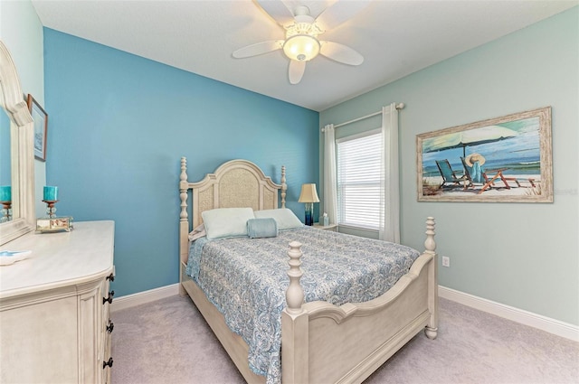 bedroom with light carpet and ceiling fan