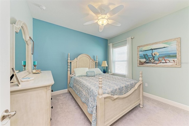 bedroom with ceiling fan and light colored carpet