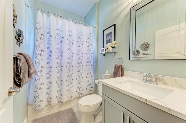 full bathroom featuring tile patterned flooring, vanity, toilet, and shower / bath combo with shower curtain