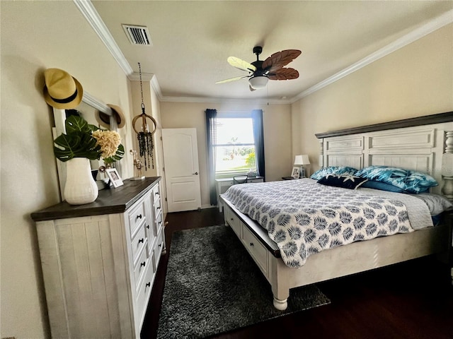 bedroom with ornamental molding, dark hardwood / wood-style floors, and ceiling fan