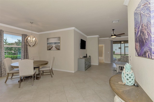 dining area featuring ornamental molding, ceiling fan with notable chandelier, and light tile patterned floors