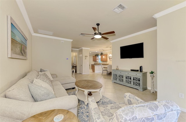 tiled living room featuring ornamental molding and ceiling fan