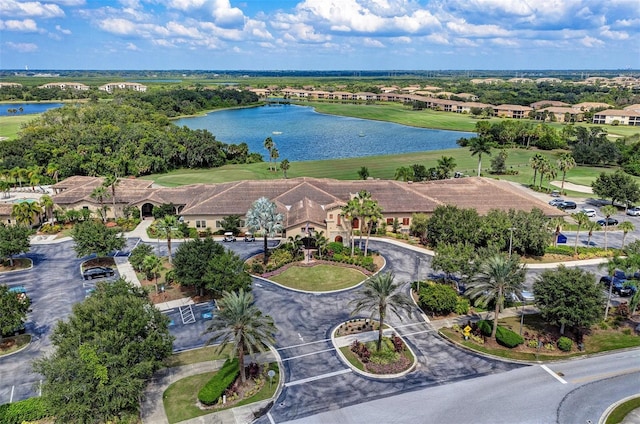 birds eye view of property with a water view