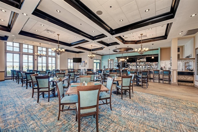 dining room with crown molding, coffered ceiling, a chandelier, and a high ceiling