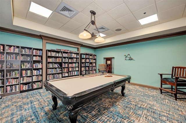 rec room with a tray ceiling, carpet flooring, and a drop ceiling