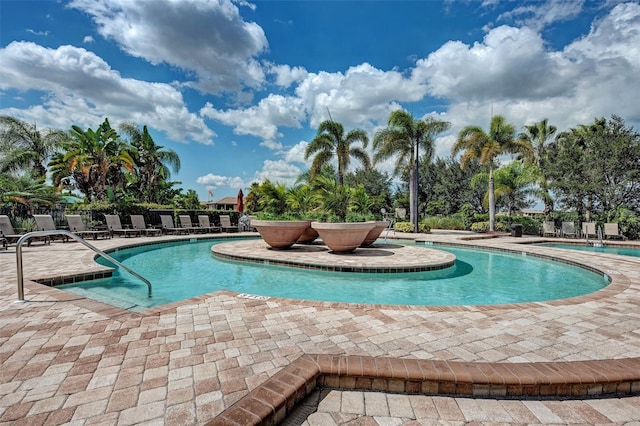 view of swimming pool with a patio