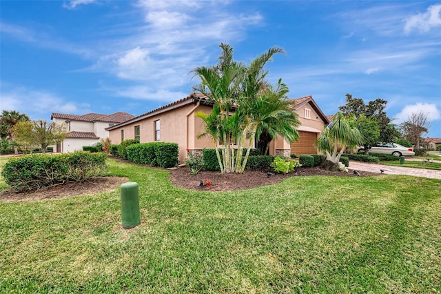 view of home's exterior with a garage and a yard