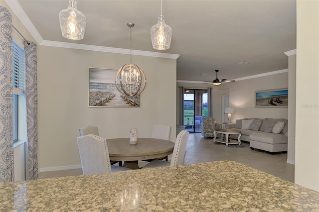 dining space with light tile patterned flooring, ceiling fan, and ornamental molding