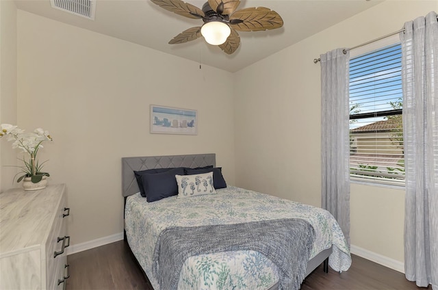 bedroom featuring ceiling fan and dark hardwood / wood-style flooring