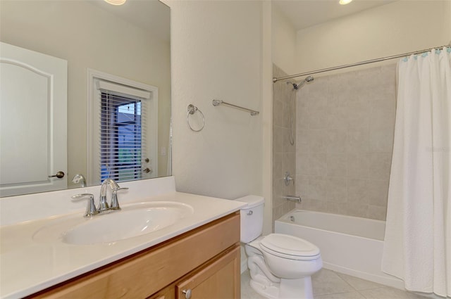 full bathroom featuring tile patterned flooring, vanity, shower / bath combo, and toilet