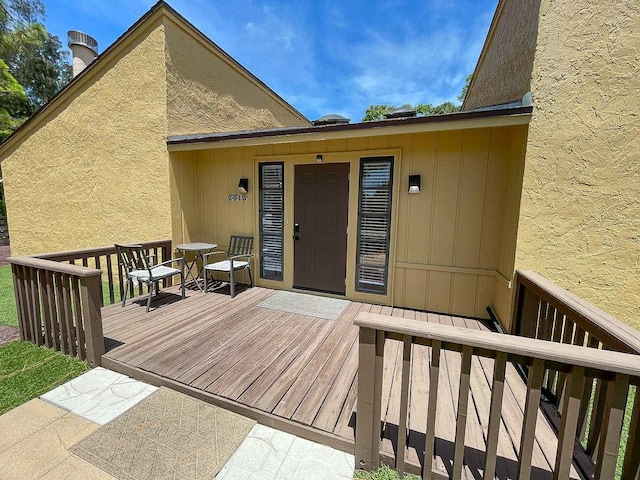 doorway to property with a deck