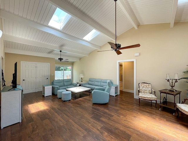 living room featuring lofted ceiling with skylight, ceiling fan, and dark wood-type flooring