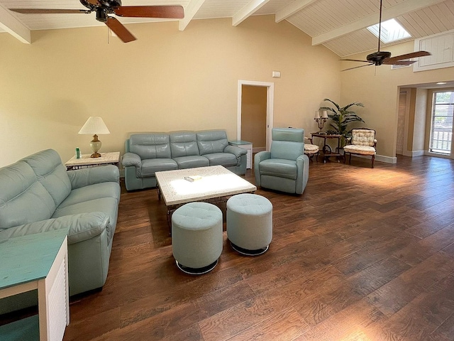 living room with ceiling fan, vaulted ceiling with skylight, and dark hardwood / wood-style flooring