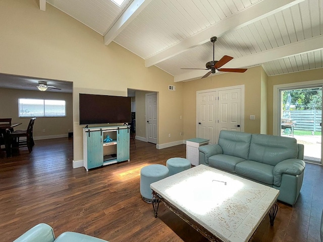 living room with ceiling fan, dark hardwood / wood-style floors, and lofted ceiling with skylight