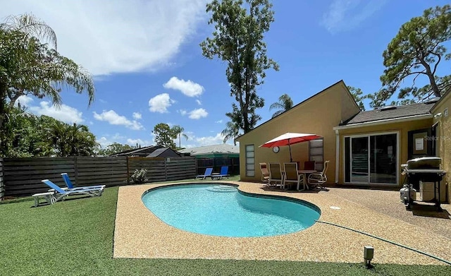 view of pool featuring a patio and area for grilling