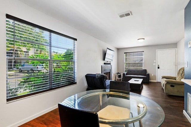 dining space featuring dark wood-type flooring