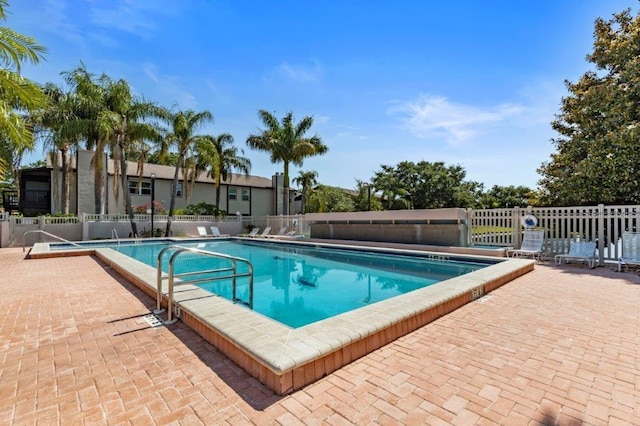 view of swimming pool featuring a patio area