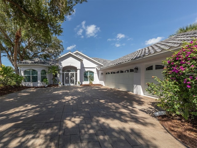 single story home with a garage